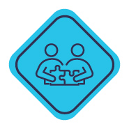 Two colleagues holding puzzle pieces that fit together.